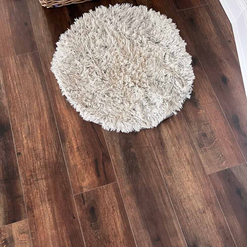 Small circular gray rug